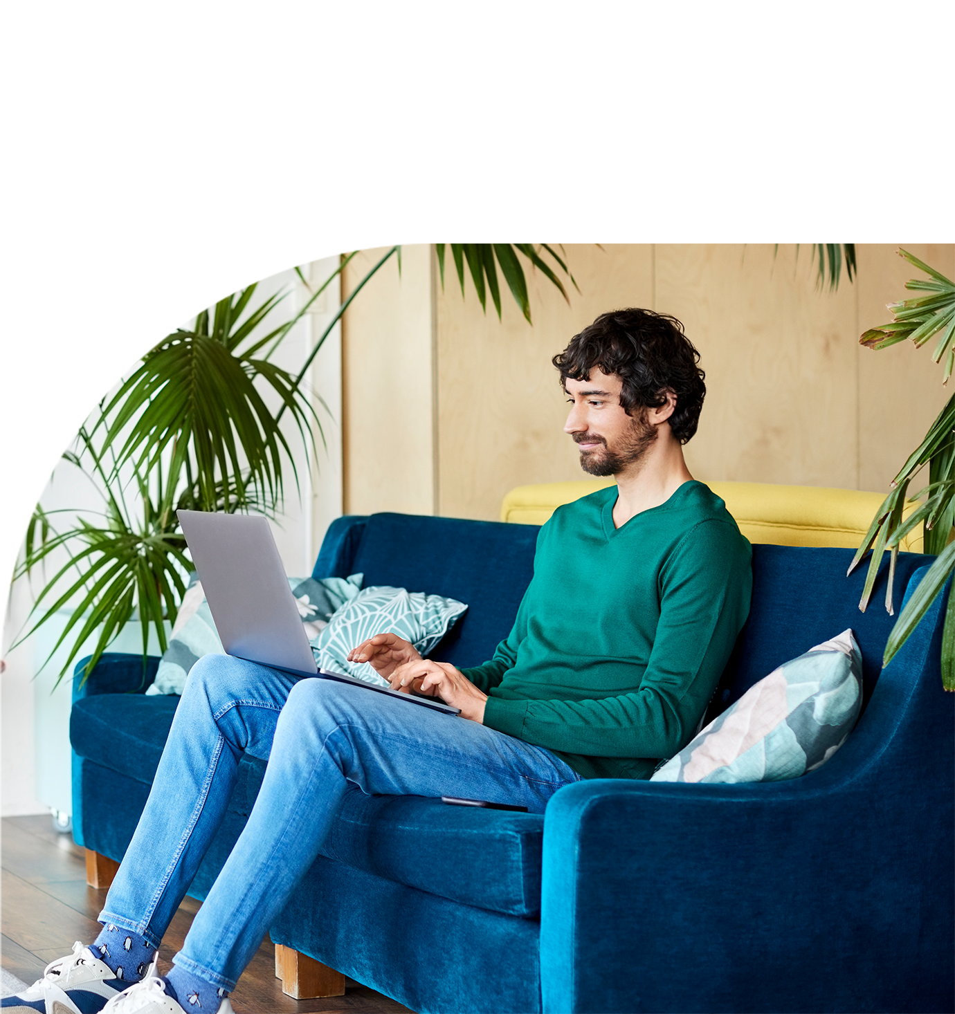 man sit with a laptop